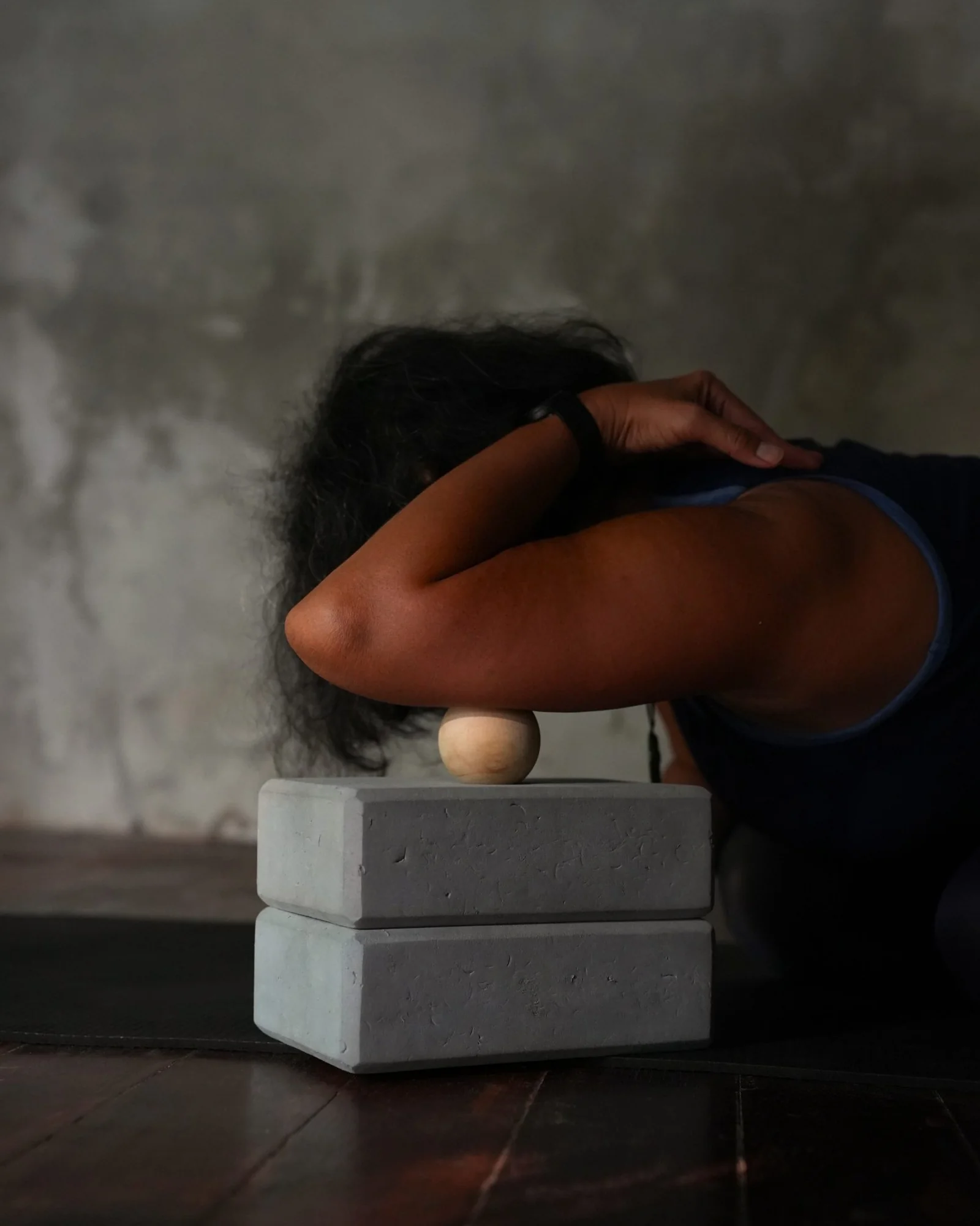 Restorative yoga pose with the head resting on yoga blocks